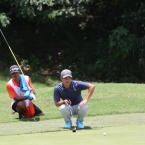 tabuena-with-his-caddie-in-hole-13-while-checking-his-line