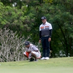 quiban with his caddie taking 2nd opinion in hole 7