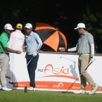 checking their ball before tee in hole 1