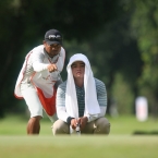 quiban assisted by his caddie in hole 4