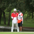 quiban with caddie study their line in 13