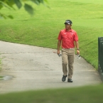 jay bayron walking alone as he leads the tour day 2